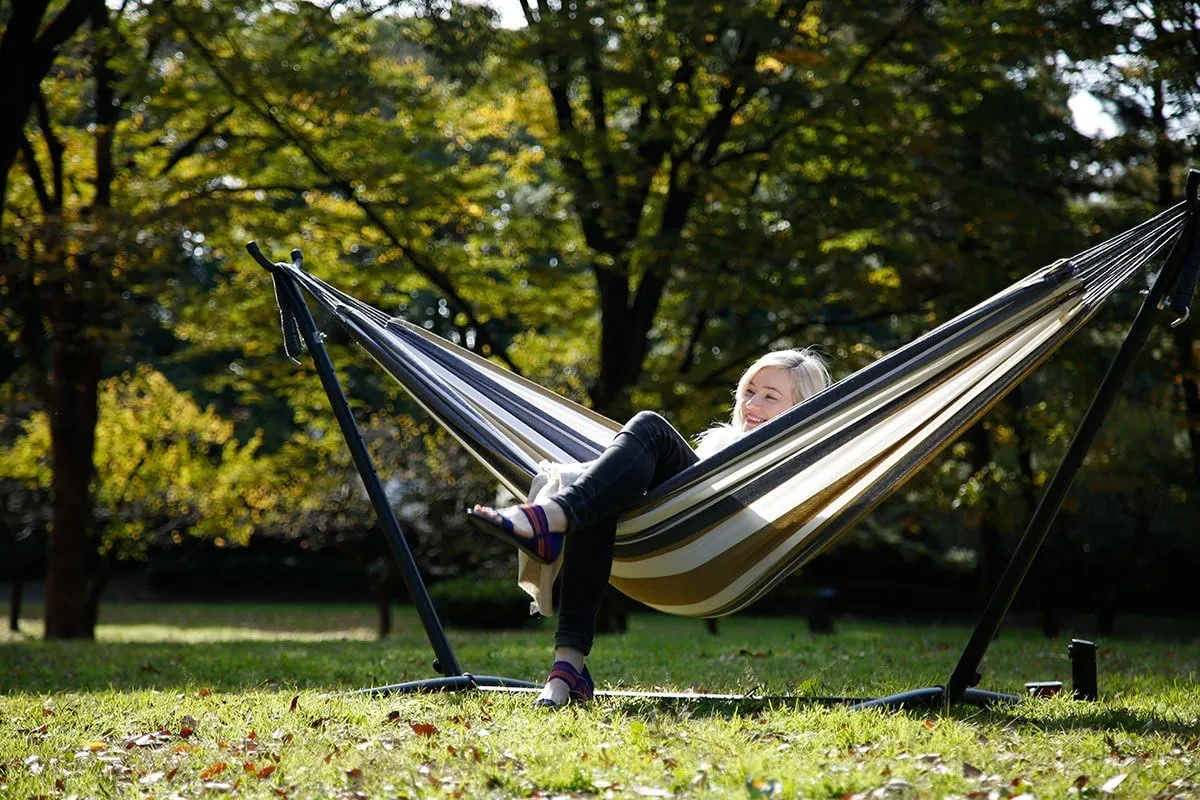 Vivere Double Cotton Hammock with Space Saving Steel Stand, Upgraded Polyester End Strings 450 lb Capacity - Premium Carry Bag Included - USA Grown Cotton (Desert Moon)